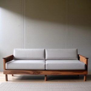 wooden sofa with fabric cushions